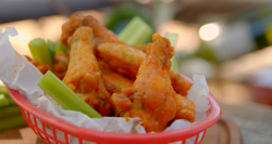 The Hairy Bikers American style chicken wings in a basket with hot spicy sauce on the Chicken an ...