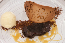 Kenny’s baked bitter chocolate ganache with bee pollen crumb, smoked caramel sauce and a a ...