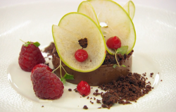 William’s chocolate cremeux with a compressed apple, raspberries and chocolate soil desser ...