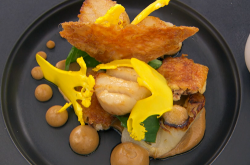 Gavin’s scallops with crispy chicken skin, yeast infused cauliflower puree and a Madeira s ...