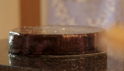 Dominic’s ruby  mirror glazed cake with a galaxy star effect on Kirstie’s Handmade Christmas