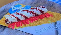 Eliza’s raspberry ripple meringue roulade on Junior Bake Off 2019