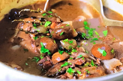 Alex Hollywood grandmother’s  coq au vin with flambe chicken, mushrooms and lardons on Nad ...