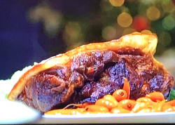 James Martin’s slow roasted shoulder of pork with apple and cider sauce, served with cabba ...