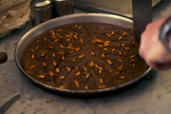 Castagnaccio flatbread dessert with chestnut flour and pine kernel on Gino’s Italian Express