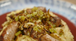 Olly’s sausages with crispy leeks, mustard mash, red wine sauce and honey-glazed parsnips  ...