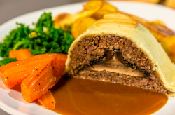 Ian and Henry (Bosh)’s Mushroom Wellington with vegetables and gravy on Living on the Veg