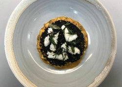 Tom Kitchin’s braised north sea squid served on a potato risotto with squid ink tuile cook ...