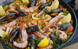 Ainsley Harriott Spanish seafood paella with parsley and lemon on Ainsley’s Mediterranean Cookbook