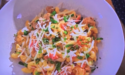 Molly Yeh’s Funeral hotdish casserole with Italian sausage, macaroni noodles, tomatoes and chees ...