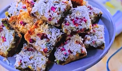 Molly Yeh’s halva magic bars with graham cracker crumbs, salted pistachios and dark chocolates o ...