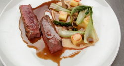 Sammy’s miso glazed duck breast with bok choy, turnip, pineapple, mushrooms and a five spi ...
