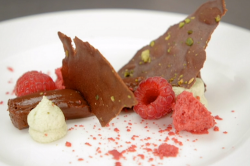 Jamaar’s dark chocolate cremeux with pistachio Chantilly cream, chocolate tuile and fresh  ...