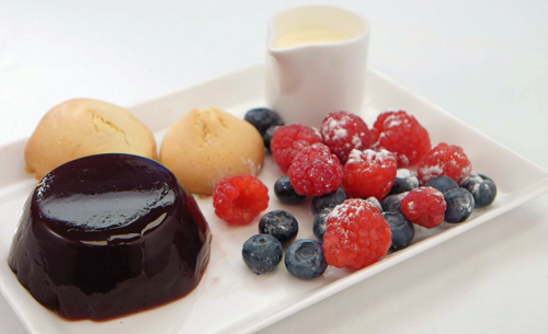 Crissy Rock’s port and wine jelly with almond biscuits, berries and cream on Celebrity Mas ...