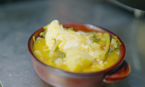 Enrico’s acquacotta vegetable broth with a poached egg on A Taste of Italy with Nisha Katona